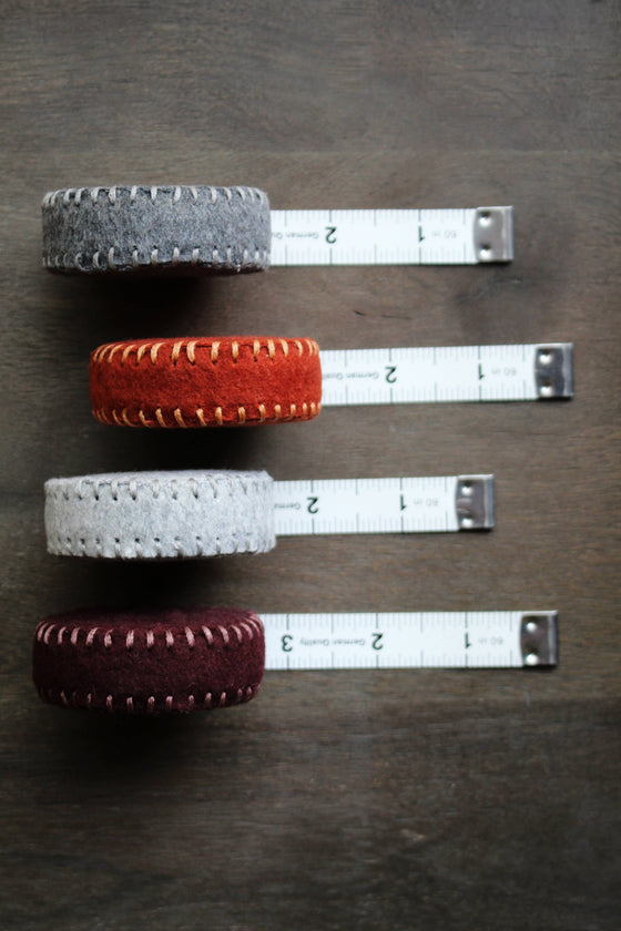 Dark Grey Hand-Stitched Woolen Tape Measure by NNK Press sold by Lift Bridge Yarns
